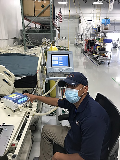 Adrian Barraza checks ventilator