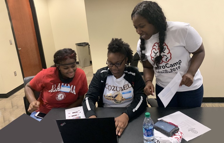 Kids studying coding at camp